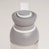PROMIXX Ecozen Hybrid water bottle in Graphite Gray — close-up of the lid, silicone seal ring and perforated mixing dome.
