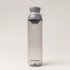 PROMIXX Ecozen Hybrid water bottle in Graphite Gray, translucent BPA-free Ecozen body, shown three-quarter front with the leakproof flip-top lid, carry loop and X-mixer agitator.