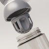 PROMIXX Ecozen Hybrid water bottle in Graphite Gray — close-up of the perforated dome mixing agitator lifting away from the bottle.