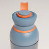 PROMIXX Ecozen Hybrid water bottle in Midnight Blue — close-up of the lid, silicone seal ring and perforated mixing dome.