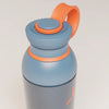PROMIXX Ecozen Hybrid water bottle in Midnight Blue, translucent BPA-free Ecozen body, upper section with the flip spout open and the perforated mixing dome seated in the neck.