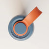 PROMIXX Ecozen Hybrid water bottle in Midnight Blue — top-down view of the lid, showing the carry loop and round flip button embossed with the PROMIXX X.